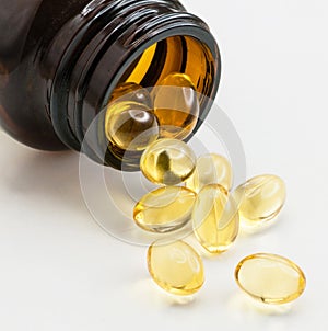 Cod liver oil gel capsules on gray background