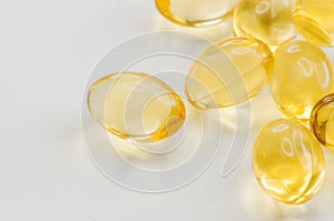 Cod liver oil gel capsules on gray background