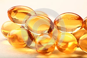 Cod-liver oil macro image of health capsules.