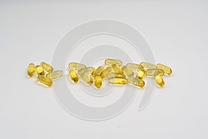 Cod liver oil omega 3 gel capsules on white background