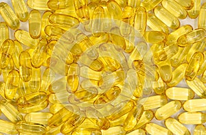 Cod liver oil omega-3 softgels. Background and texture from capsules