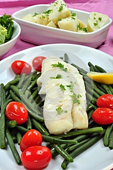 Cod loins with beans and tomato