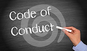 Code of Conduct chalkboard with female hand