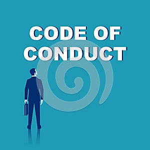 Code of conduct concept. Businessman stands in front of the word