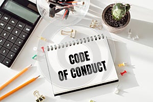 Code of Conduct Text written on notebook page. Motivational Concept image