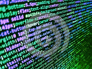 Code on dark background. Developer working on program codes in office. Javascript code in bracket software. Web or application