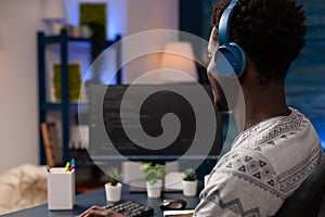 It code developer wearing headset programming codes for firewall server