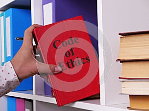 Code of Ethics is shown on the photo using the text