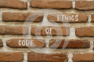 Code of ethics symbol. Concept words Code of ethics on brick wall. Beautiful brick wall background. Business ethic and code of