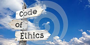 Code of ethics - wooden signpost with three arrows