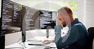 Coder Using Computer At Desk photo
