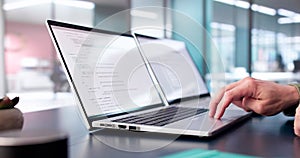 Coder Using Computer At Desk