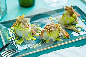 Codfish carpaccio with fried artichoke and tuna bottarga