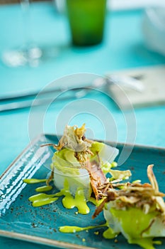 Codfish carpaccio with fried artichoke and tuna bottarga