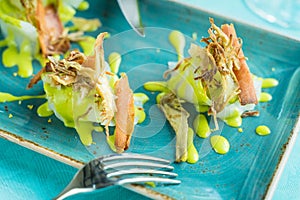 Codfish carpaccio with fried artichoke and tuna bottarga