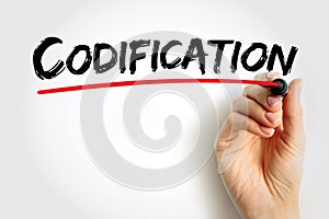 Codification - the action or process of arranging laws or rules according to a system or plan, text concept background photo