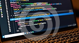 Coding on computer screen vibrant colors of code with keyboard detail