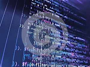 IT coding on monitor screen. Programming, webdesign HTML printed code. Close up of random computer code comprised of numbers and