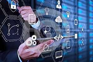 businessman hand using tablet computer and server room