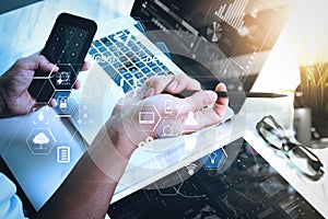 business man hand working on computer laptop computer and digital tablet and smart phone on marble desk as concept