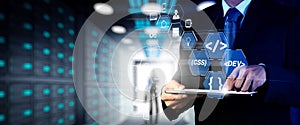 Coding software developer work with augmented reality dashboard computer icons of scrum agile development and code fork and versio
