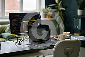 Coding Workspace with Dual Monitor Setup in Modern Office
