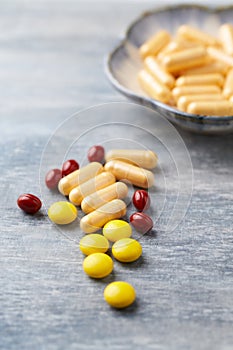 Coenzyme Q10 capsules, Vitamin C and Beta-Carotene tablets. Antioxidants. Concept for a healthy dietary supplementation.