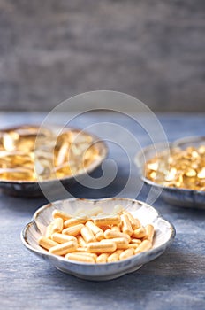 Coenzyme Q10, Omega 3 and Vitamin E capsules. Dietary supplements.