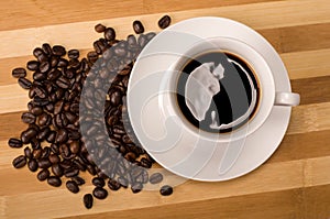 Cofee and coffee bean on wooden board