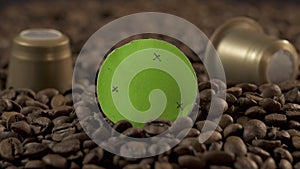 Coffe beans and golden coffee capsules with green screen