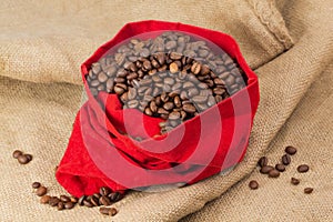 Coffe beans in red velvet sac