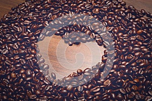 Coffe beans on the table in the morning with heart shape inside