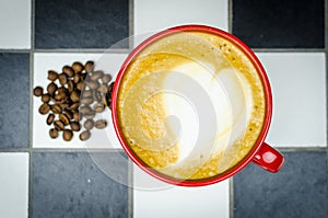 Coffe Cup with Beans on Checkedboard