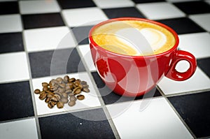 Coffe Cup with Beans on Checkedboard