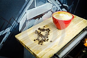 Coffe Cup with Beans on Plate