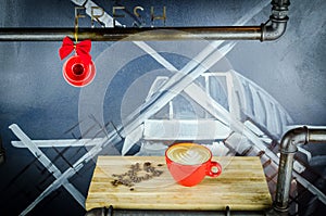 Coffe Cup with Beans on wooden plate