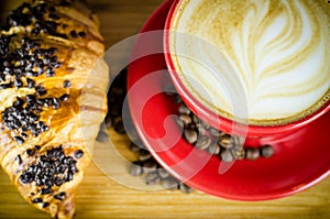 Coffe Cup and Croissant with Beans on Plate