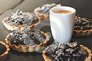 Coffe cup wits delicious chocolate tarts