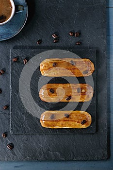 Coffe eclairs with cup of coffee