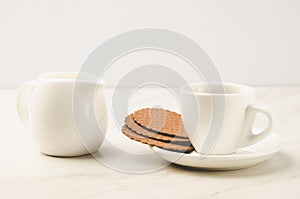 Coffe espresso white cup with cookies and milk/Coffe espresso white cup with cookies and milk on a white background. selective