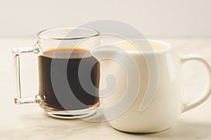 Coffe glass with milk/Coffe glass with milk on white marble background. Selective focus