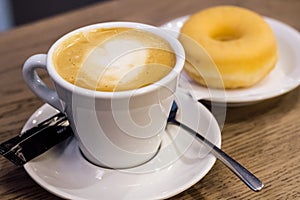 Coffe milk and donnut in the morning photo