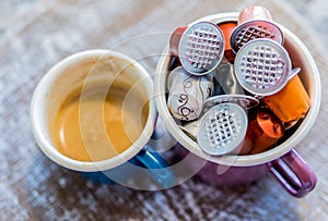 Coffe pods in enamel mug