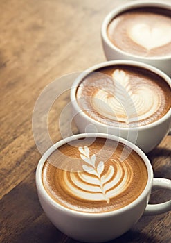 Coffee cups decorated with milk froth. photo