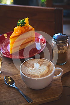 coffee aroma cup and tasty cake fruit on wood table in cafe coffee shop vintage style