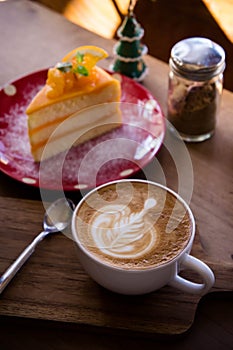 coffee aroma latte art cup and tasty christmas cake on wood table relaxtime in cafe coffee shop