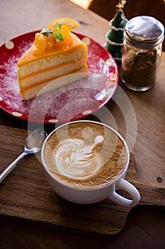 coffee aroma latte art cup and tasty christmas cake on wood table relaxtime in cafe coffee shop