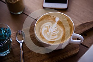 coffee aroma latte art cup on wood table relaxtime in cafe coffee shop