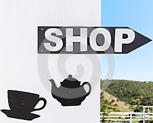 Coffee arrow sign in Mertola, Portugal.