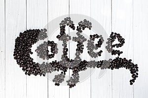 Coffee background with beans and white cup. copy space.